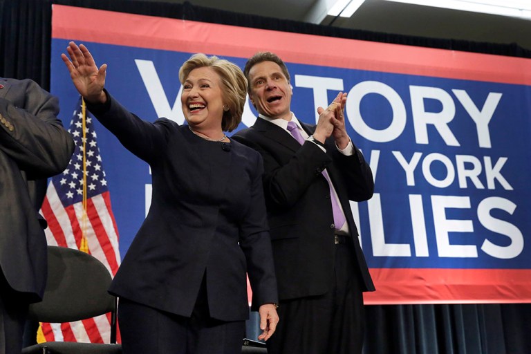 Hillary Clinton and New York Gov. Andrew Cuomo wave to the crowd as they are introduced at an event in New York, Monday, April 4, 2016. (AP Photo/Richard Drew)