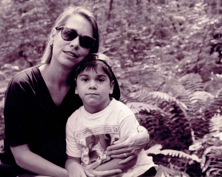 In this 1990s-era photo toned by the source, human rights activist Cathy Potler poses with her son Natan Vega Potler, in upstate New York. Potler, who investigated human rights abuses in South and Central America in the 1970s and '80s, as well as in jails and prisons throughout New York state, died of non-small cell lung cancer in the early hours of Sept. 21, 2014. She was 61. (AP Photo/Martin Vega)