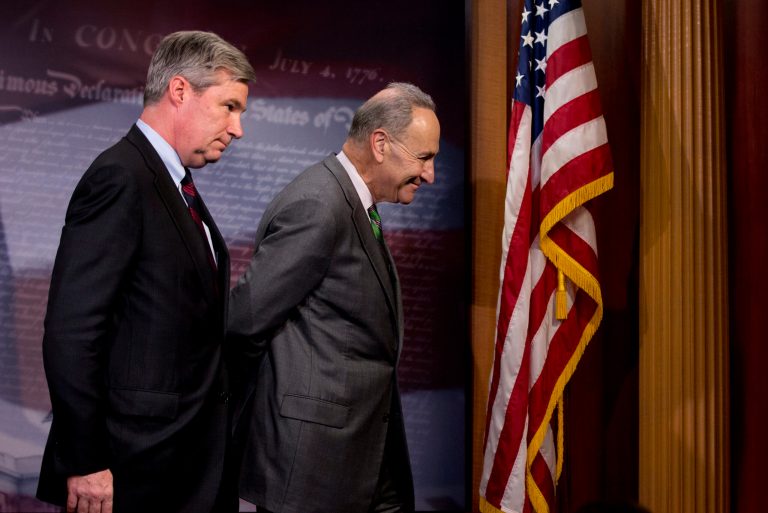 Sen. Charles Schumer, D-N.Y., right, followed by Sen. Sheldon Whitehouse, D-R.I. leave a news conference on Capitol Hill in Washington, Wednesday, April 2, 2014, where they talked about the Supreme Court decision in the McCutcheon vs. FEC case, in which the Court struck down limits in federal law on the aggregate campaign contributions individual donors may make to candidates, political parties, and political action committees.  (AP Photo/Manuel Balce Ceneta)