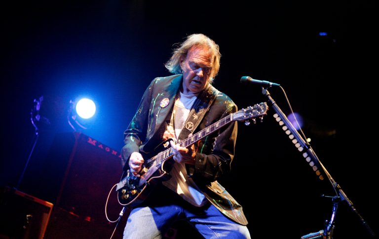   FILE - In this Monday, Dec. 15, 2008, file photo, Neil Young performs at Madison Square Garden in New York. Neil Young said, Sunday, Dec. 2, 2012, he couldn't see performing in the area devastated by Superstorm Sandy without doing something to help people who were affected by it. Young and his longtime backing band, Crazy Horse, will be near Atlantic City's devastated boardwalk for a benefit concert Thursday. (AP Photo/Jason DeCrow, File)  