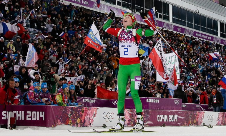 Belarus' Darya Domracheva celebrates winning the gold medal in the women's biathlon 12.5k mass-start, at the 2014 Winter Olympics, Monday, Feb. 17, 2014, in Krasnaya Polyana, Russia. (AP Photo/Felipe Dana)