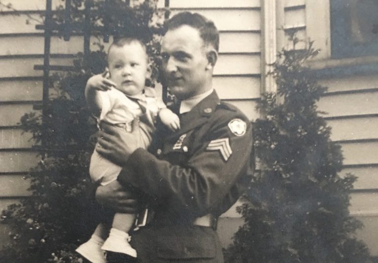 Sgt. Langille holding his son Steven outside his Medford, Mass. home. (Langille family photo)