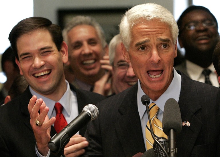 FILE- In this May 4, 2007 file photo, Florida Gov. Charlie Crist, left, and House Speaker Marco Rubio, R-Coral Gables, left, take part in closing ceremonies of the Florida Legislature, in Tallahassee, Fla. If former Florida Gov. Charlie Crist wins his old job back as a Democrat, he could be in a position to seek political revenge against two Republicans whom he once counted as friends, Jeb Bush and Sen. Marco Rubio. (AP Photo/Phil Coale, File)