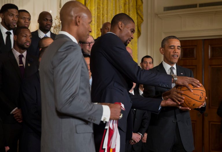 MiamiÃÂ HeatÃÂ player Ray Allen, left, holds aÃÂ jersey as teammate Chris Bosh presents PresidentÃÂ ObamaÃÂ with a signed basketball at the White House on Tuesday. (AP/Jacquelyn Martin)