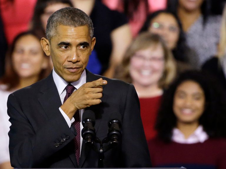 President Barack Obama gestures towards the crowd as they respond to his words while he speaks about the economy after participating in a roundtable discussion with working parents, small business owners, students and faculty, Friday, Oct. 31, 2014, at Rhode Island College in Providence, R.I. (AP Photo/Stephan Savoia)