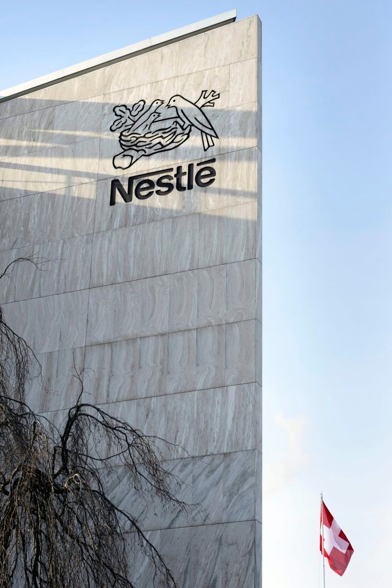 FILE - In this Feb. 14, 2013 file picture the Nestle logo is  photographed  on the Nestle headquarter  in Vevey, Switzerland.  Swiss food and drink giant Nestle and French cosmetics company L'Oreal announced Tuesday Feb. 11, 2014  a deal to transfer ownership of Swiss dermatology pharmaceuticals company Galderma. The companies said in a joint statement that L'Oreal will buy 48.5 million of its own shares, or 8 percent of its share capital, from Nestle and give Nestle its 50 percent stake in Galderma, which has been a 50/50 joint venture between them. (AP Photo/Keystone,Laurent Gillieron)