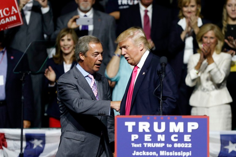Republican presidential candidate Donald Trump welcomes Nigel Farage, left, ex-leader of the British UKIP party, to speak at a Wednesday campaign rally in Jackson, Miss. (AP Photo/Gerald Herbert)