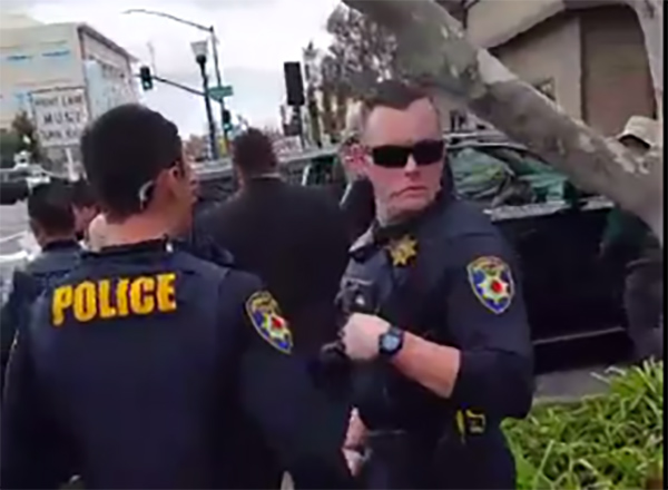 Republican congressman Tom McClintock was given a police escort out of a town hall near Sacramento, Calif., on Saturday. (Screen shot)
