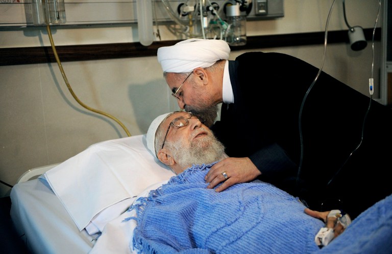 In this picture released by the official website of the office of the Iranian supreme leader, President Hassan Rouhani kisses the forehead of Supreme Leader Ayatollah Ali Khamenei after his surgery at a hospital in Tehran, Iran, Monday, Sept. 8, 2014. Iran's supreme leader underwent prostate surgery on Monday and was recovering at a government hospital in Tehran, state media said in a rare report on the state of health of the country's top cleric. The 75-year-old, who has final say on all state matters and has been Iran's top leader since 1989, was reported to be in 
