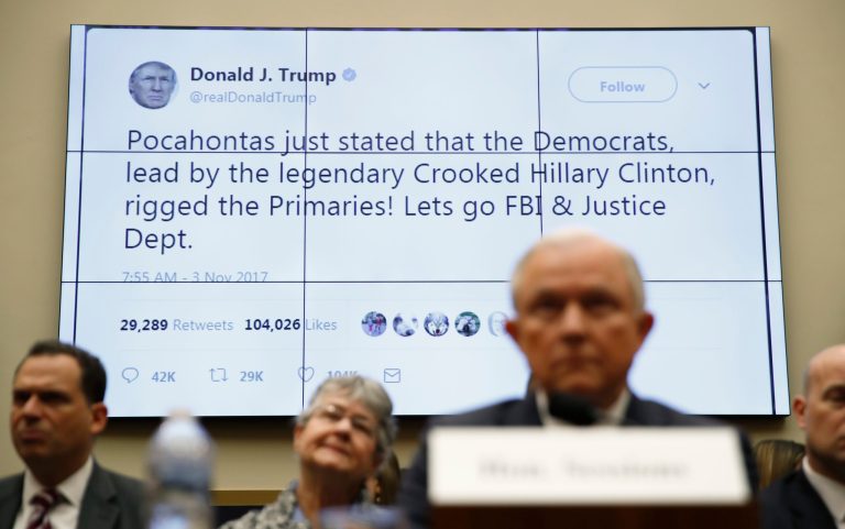 A tweet by President Donald Trump is displayed behind Attorney General Jeff Sessions as he testifies during a House Judiciary Committee hearing on Capitol Hill, Tuesday, Nov. 14, 2017 in Washington. (AP Photo/Carolyn Kaster)