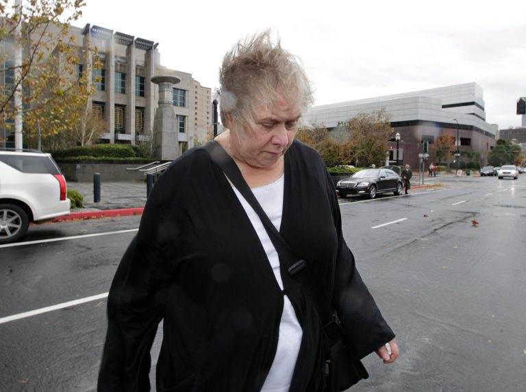In this Nov. 28, 2012 file photo, former Democratic campaign treasurer Kinde Durkee leaves the federal courthouse in Sacramento, Calif.,  after she was sentenced to more than eight years in federal prison for defrauding high-profile clients, such as U.S. Sen. Dianne Feinstein. More than a year after being ordered to repay the $10.5 million she embezzled, federal officials say they have only been able to recover $94,468.80 from the liquidation of her assets that was to go to restitution.(AP Photo/Rich Pedroncelli, file)