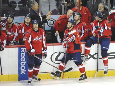 Nick Wass/AP
Dennis Wideman(6)initially was credited with his third goal of the night Friday, but the NHL later gave the tally to Brooks Laich(21).