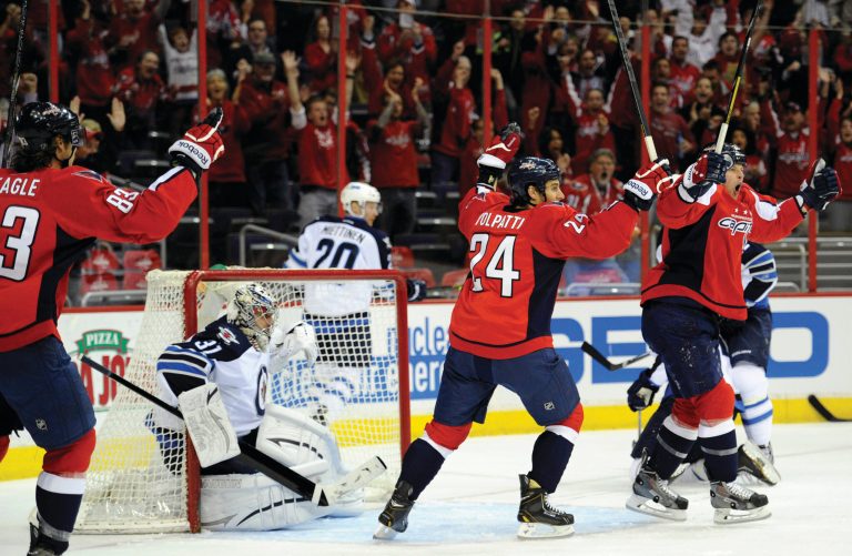 Nick Wass/AP
Capitals center Matt Hendricks, right, scored the first of Washington's five goals in a playoff-clinching win over the Jets on Tuesday.