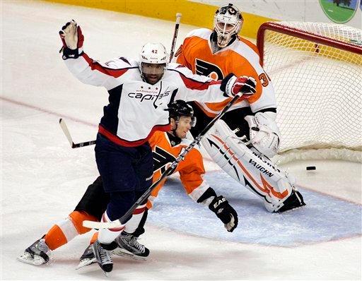 Caps win battle between NHL unbeatens, take down Detroit 7-1