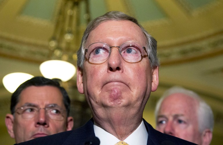 Senate Minority Leader Sen. Mitch McConnell, R-Ky., center, speaks to the media on Capitol Hill in Washington Tuesday, June 19, 2012. Others are Sens. John Cornyn, R-Texas, right, and John Barrasso, R-Wyo.  (AP Photo/Manuel Balce Ceneta)