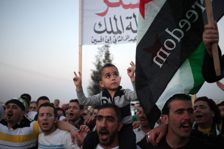 Syrian expatriates chant anti-Assad slogans as they celebrate the Jordanian government's  decision to expel the Syrian Ambassador, Bahjat Suleiman, in Amman, Jordan, Monday, May 26, 2014.  Jordan has expelled the Syrian ambassador from the country, giving him 24 hours to leave Amman. The state-run Petra news agency said Monday, May 26, 2014 that the government declared Ambassador Bahjat Suleiman persona non-grata on Monday and asked him to leave. (AP Photo/Mohammad Hannon)