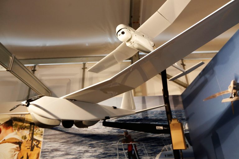 An AeroVironment Puma AE, front, and Raven small unmanned aircraft systems are displayed at the AeroVironment stand during Farnborough International Air Show, Farnborough, England, Tuesday, July 15, 2014. (AP Photo/Sang Tan)