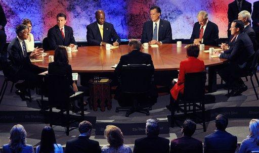 Republican presidential candidate former Utah Gov. Jon Huntsman, from left, speaks as Rep. Michele Bachmann, R-Minn., Texas Gov. Rick Perry, businessman Herman Cain, former Massachusetts Gov. Mitt Romney, Rep. Ron Paul, R-Texas, former House Speaker Newt Gingrich and former Pennsylvania Sen. Rick Santorum at a presidential debate at Dartmouth College in Hanover, N.H., Tuesday, Oct. 11, 2011. (AP Photo/Toni Sandys, Pool)