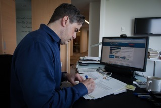 Judicial Watch President Tom Fitton works on a filing in a Freedom of Information Act  case. (Photo by Graeme Jennings, the Washington Examiner)