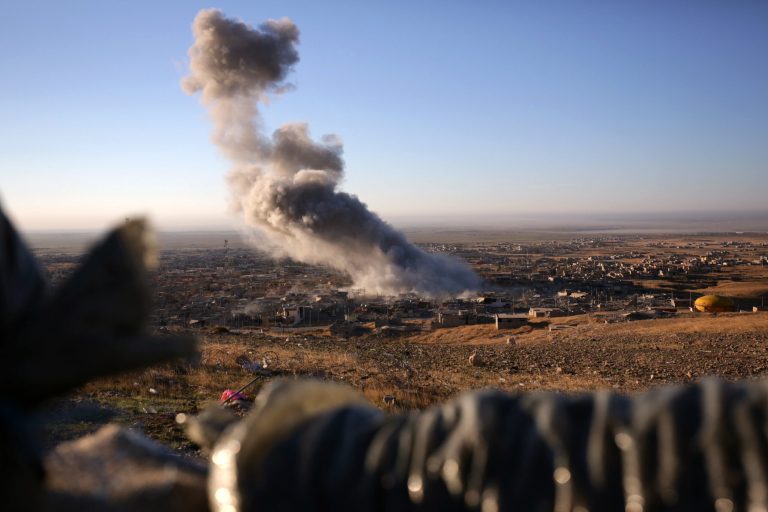 Kurdish Iraqi fighters, backed by the U.S.-led air campaign, launched an assault Thursday aiming to retake the strategic town of Sinjar. (AP Photo/Bram Janssen)