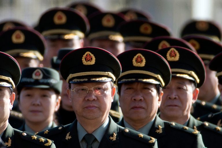 Delegates from China's People's Liberation Army (PLA) march from Tiananmen Square to the Great Hall of the People to attend sessions of National People's Congress and Chinese People's Political Consultative Conference in Beijing, China, Tuesday, March 4, 2014. (AP Photo/Ng Han Guan)