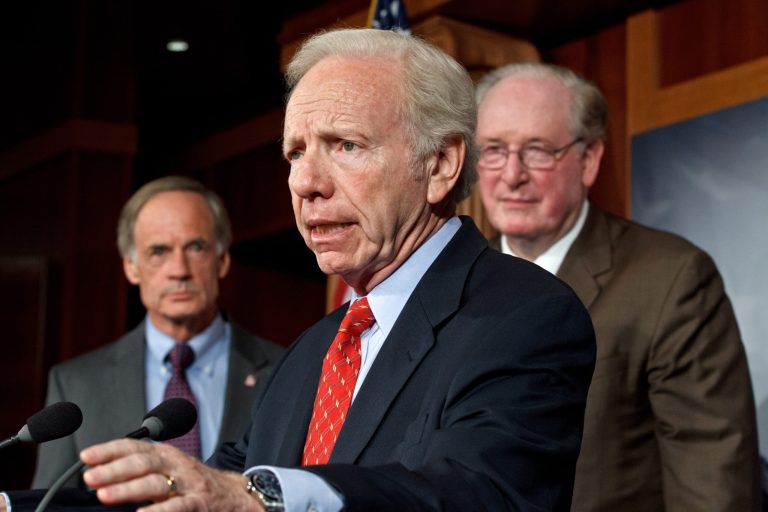 Sen. Joseph I. Lieberman, I-Conn., joined by Sen. Jay Rockefeller, D-W.V., right, and Sen. Tom Carper, D-Del., left, to announce that the Senate will take up legislation later this week to protect critical U.S. industries and other corporate networks from cyberattacks and electronic espionage, at the Capitol in Washington, Tuesday, July 24, 2012. (AP Photo/J. Scott Applewhite)