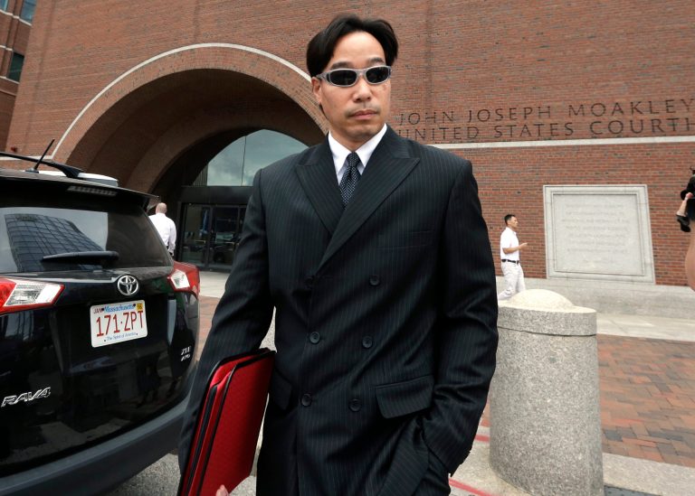 Glenn Adam Chin, former supervisory pharmacist at the New England Compounding Center, departs federal court, Thursday, Sept. 11, 2014, in Boston. Prosecutors say Chin oversaw the sterile clean rooms at the New England Compounding Center in Framingham, Mass., which custom-mixed medications in bulk and where tainted steroids blamed for the 2012 outbreak were made. (AP Photo/Steven Senne)