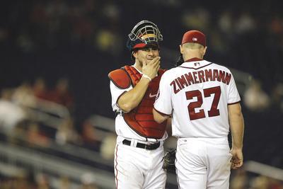 Rob Carr/Getty Images
Catcher Jesus Flores has been praised for the way he calls games, but the Nationals want him to work on throwing out runners.
