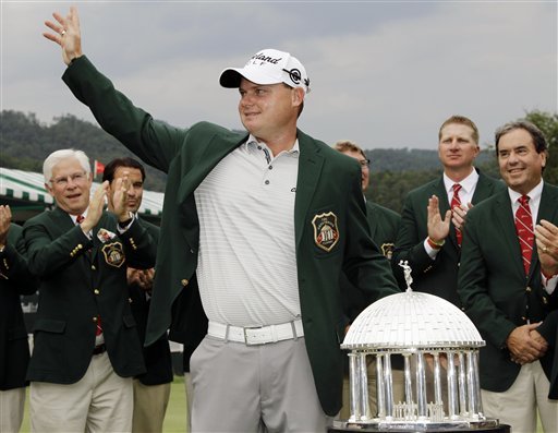 Ted Potter Jr. waves to the crowd as he celebrates winning the Greenbrier Classic PGA Golf tournament at the Greenbrier in White Sulphur Springs, W.Va., Sunday, July 8, 2012. Potter won in a two-hole playoff with Troy Kelly. (AP Photo/Steve Helber)