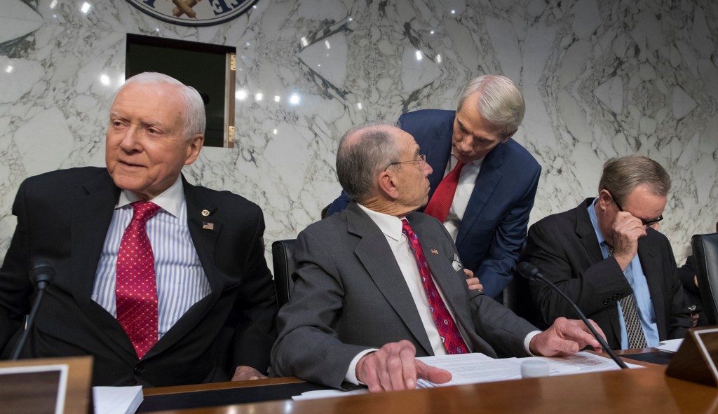 Finance committee halts work to fix Senate tax bill’s budget problems