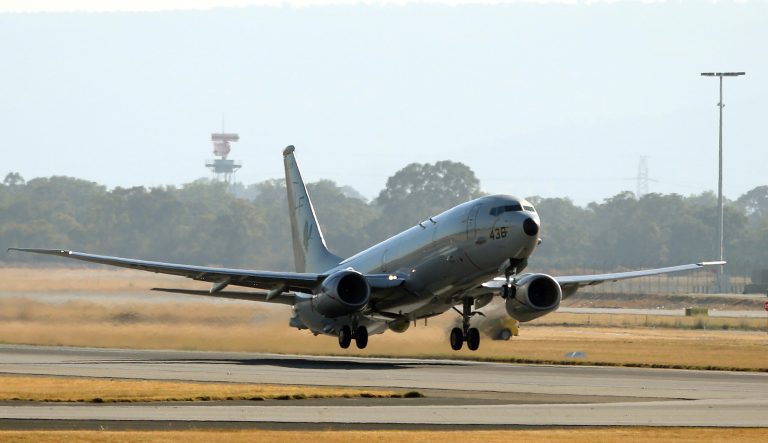 A U.S. Navy P8 Poseidon takes off from Perth Airport en route to rejoin the ongoing search operations for missing Malaysia Airlines Flight 370 in Perth,  Australia, Sunday, April 13, 2014. Military planes and ships from seven nations continue to scourer the Indian Ocean off the coast of western Australia for Flight 370 in one of the largest maritime multi-nation searches in history. (AP Photo/Rob Griffith)