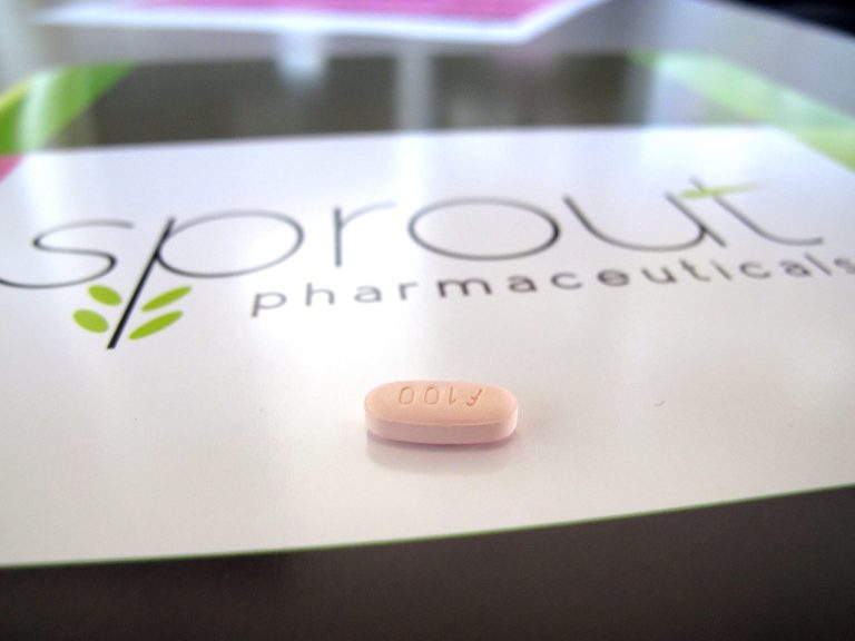 FILE - In this Friday, Sept. 27, 2013, file photo, a tablet of flibanserin sits on a brochure for Sprout Pharmaceuticals in the company's Raleigh, N.C., headquarters. Sprout Pharmaceuticals said Tuesday, Feb. 11, 2014, that the Food and Drug Administration wants to see more data on how the company's drug, flibanserin, interacts with other medications and how it affects driving ability. Nearly 10 percent of women studied in company trials reported sleepiness while taking the daily pill. (AP Photo/Allen G. Breed)