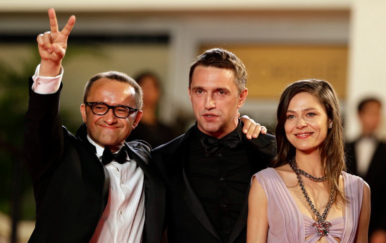 From left, director Andrey Zvyagintsev, actor Vladimir Vdovichenkov and actress Elena Lyadova pose for photographers as they arrive for the screening of Leviathan at the 67th international film festival, Cannes, southern France, Friday, May 23, 2014. (AP Photo/Thibault Camus)