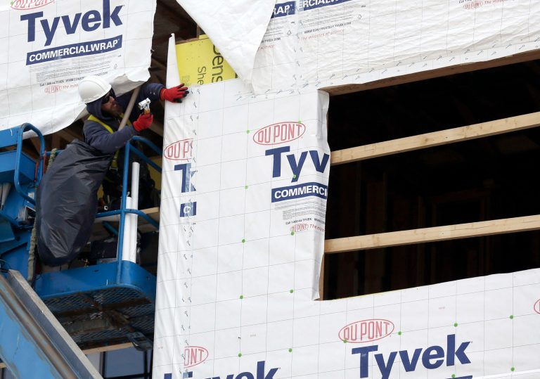 FILE - In this March 26, 2014 photo, a builder works on a home under construction in northwest Chicago. The Commerce Department reports on U.S. home construction in April on Friday. May 16, 2014. (AP Photo/Nam Y. Huh, File)