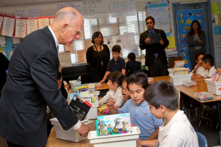 California Gov. Jerry Brown talks with students of a second-grade class at Perkins Elementary School on Tuesday, Oct. 23, 2012, in San Diego. California was once considered an 