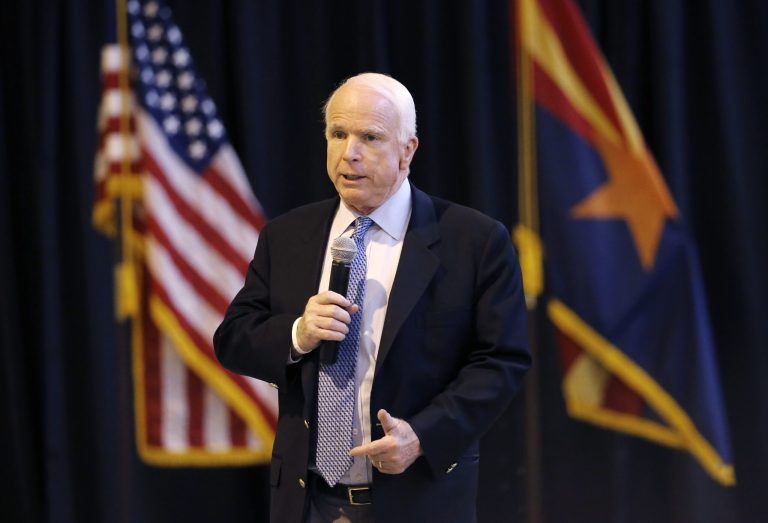 U.S. Sen. John McCain, R-Ariz., speaks to workers at MD Helicopters, Friday, May 30, 2014, in Mesa, Ariz. McCain addressed numerous issues, including the ongoing VA situation, in the town hall style meeting. (AP Photo/Matt York)