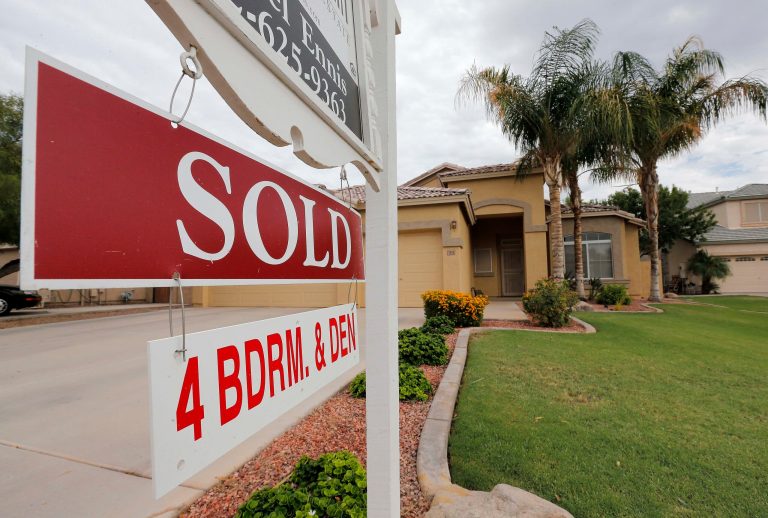 In this Monday, Aug. 26, 2013 photo, a used home is listed as sold, in Gilbert, Ariz.  Freddie Mac reports on mortgage rates for this week Thursday Oct. 17, 2013. (AP Photo/Matt York)