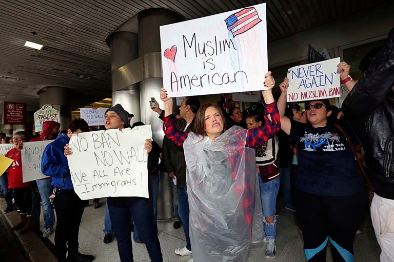 Protesters rally against President Trump's refugee ban at Miami International Airport on Sunday, Jan. 29, 2017.President Donald Trump's immigration order sowed more confusion and outrage across the country Sunday, with travelers detained at airports, panicked families searching for relatives and protesters registering their opposition to the sweeping measure. (C.M. Guerrero/El Nuevo Herald via AP)