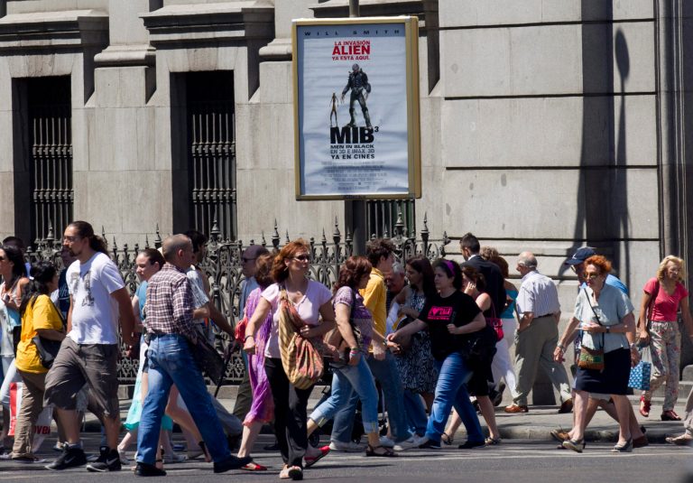   A movie poster for the film 'Men in Black' hangs outside the Bank of Spain in Madrid Tuesday June 5, 2012. Finance Minister Cristobal Montoro speaking on Onda Cero radio Tuesday said that the men in black would not be coming to Spain in reference to international inspectors. Montoro also said the amount of money needed to recapitalize Spain's troubled banking sector is not excessively high and calls on the European Union to move faster toward a banking union that would allow ailing entities to seek help without governments intervening. (AP Photo/Paul White)  