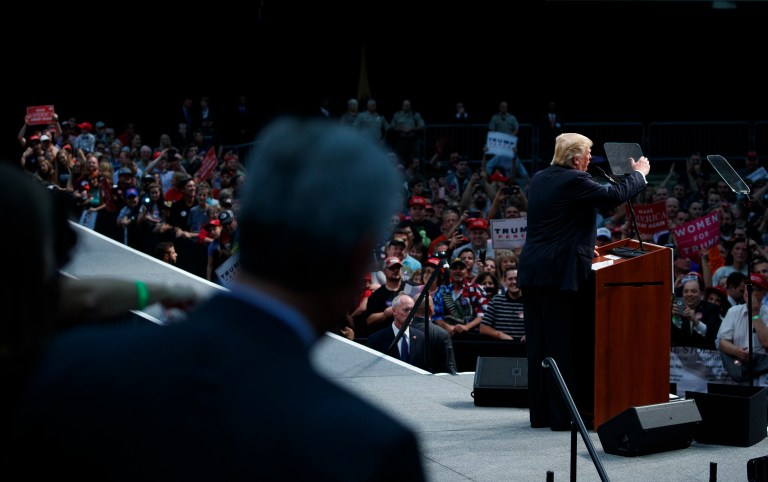 Republican presidential candidate Donald Trump praised the veterans sitting behind him onstage in North Carolina, and spoke about Medal of Honor winners' bravery in relation to his own work as a businessman. (AP Photo/ Evan Vucci)