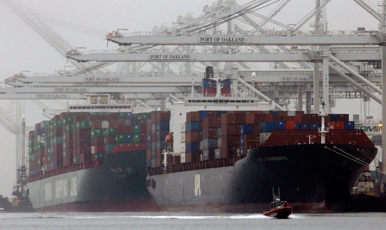 FILE - In this Wednesday, Oct. 23, 2013, file photo, container ships wait to be off loaded in a thick fog in Oakland, Calif.  The government reports on the U.S. trade deficit for October on Wednesday, Dec. 4, 2013. (AP Photo/Ben Margot, File)