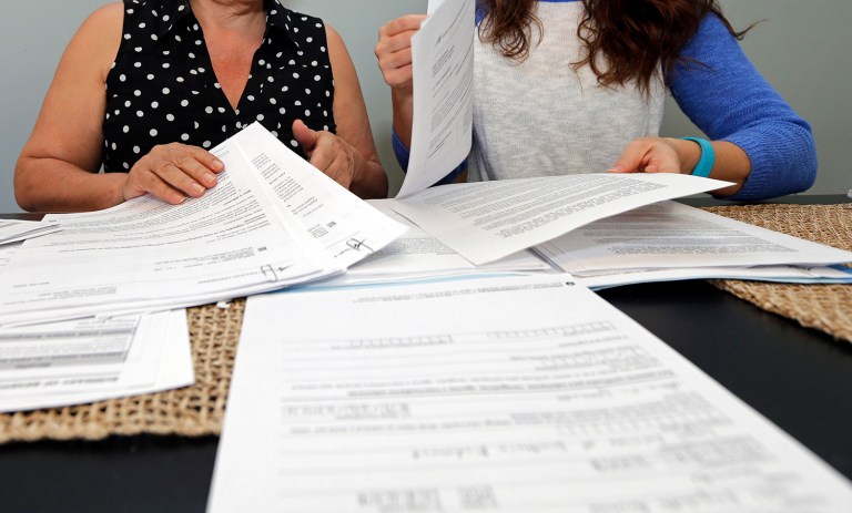 Insurers are working to repeal the health insurance tax, saying that costs will be shifted onto consumers in the form of higher premiums. (AP Photo/Chuck Burton)