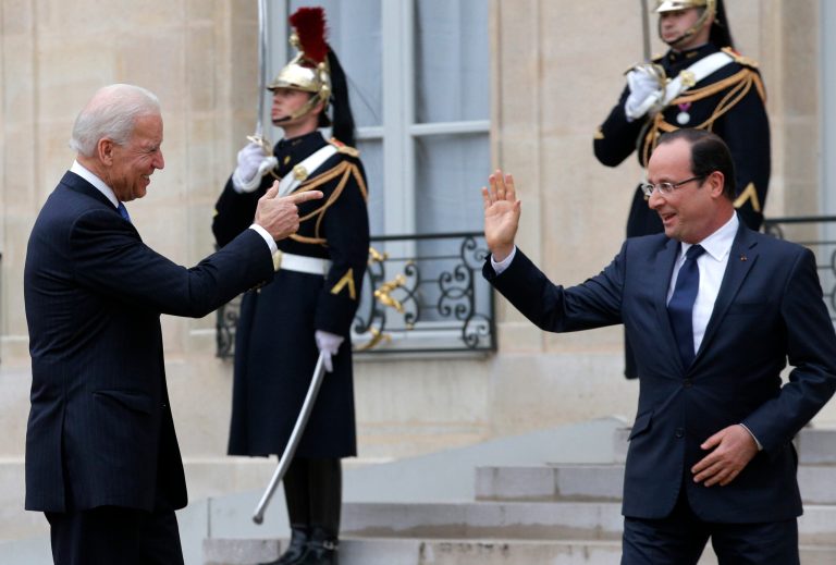   U.S. Vice President Joe Biden, left, jokes with French President Francois Hollande as he leaves the Elysee Palace after their talks, in Paris, Monday, Feb. 4, 2013. (AP Photo/Christophe Ena)