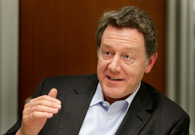 In this Thursday, May 1, 2014 photo, Domino's Pizza CEO Patrick Doyle answers questions during an interview in New York. After having been plagued with a reputation for tasting generic and manufactured, the Ann Arbor, Mich.-based chain has been enjoying strong sales and growth overseas boasting nearly 6,000 international locations. (AP Photo/Julie Jacobson)