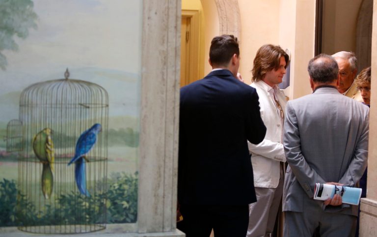 Raffaele Sollecito, second from left, and his father Francesco, second from right, listen to lawyers Luca Mauri, center with gray suit, and Giulia Bongiorno, right, before giving a press conference in Rome, Tuesday, July 1, 2014. Amanda Knox's ex-boyfriend says the American student provided alibis for him he hopes will persuade Italy's top criminal court to overturn his conviction for the 2007 murder of her British roommate. Sollecito told reporters in Rome Tuesday the Florence appeals court that convicted both of them in January, in explaining its verdict, cited a memo Knox wrote saying he wasn't involved in Meredith Kercher's murder. The 30-year-old Italian also cited a Knox text message he contended would bolster his claim of innocence. (AP Photo/Riccardo De Luca)