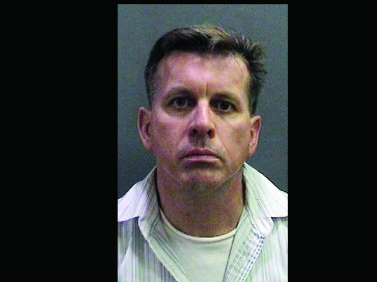 This image provided by the Orange County District Attorney's Office shows a booking photo of Rainer Reinscheid, 48, a professor at the University of California, Irvine, who was arrested July 24, 2012 and charged with numerous felony arson charges. Bail has been denied for a college professor charged with arson for allegedly setting a series of fires at an Orange County high school his son once attended before committing suicide. District attorney's spokeswoman Farrah Emami says a judge ordered Reinscheid held without bail at a hearing Tuesday, and postponed his arraignment until Aug. 8. (AP Photo/Orange County District Attorney's Office)