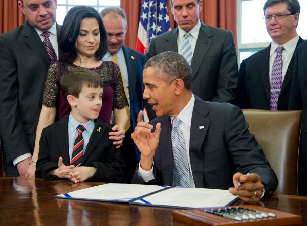 Obama signs cancer research bill in memory of girl