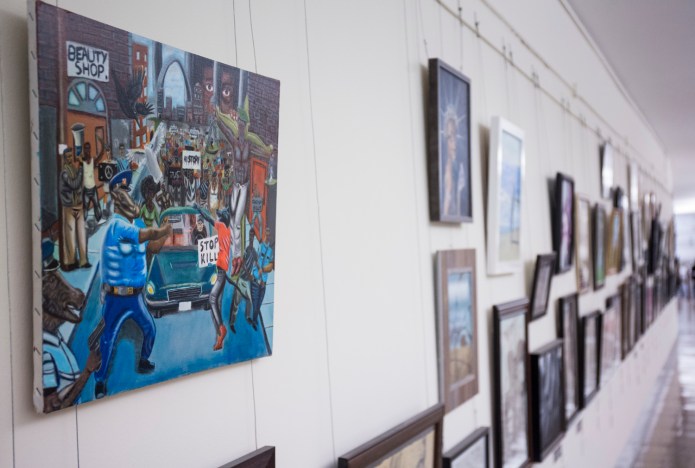 Rep. Duncan Hunter, R-Calif., first removed the artwork and Clay hung it back up. (AP Photo/Zach Gibson)