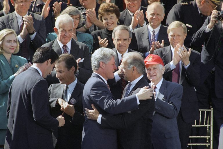 President Bill Clinton hugs Sen. Joseph Biden, D-Del., then Chairman of the Senate Judiciary Committee, after signing the $30 billion crime bill that included the Violence Against Women Act. (AP Photo/Dennis Cook)