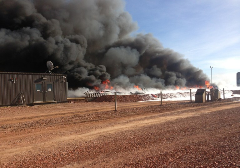 In this Nov. 7, 2013 photo provided by McKenzie County Emergency Management is a fire at a saltwater disposal site in western North Dakota's McKenzie County. State officials are investigating the cause of an explosion and fire destroyed 13 storage tanks and resulted in a spill of 270 barrels of oil and 2,440 barrels of saltwater, a byproduct of oil and gas production. One barrel holds 42 gallons. (AP Photo/McKenzie County Emergency Management, Jerry Samuelson)